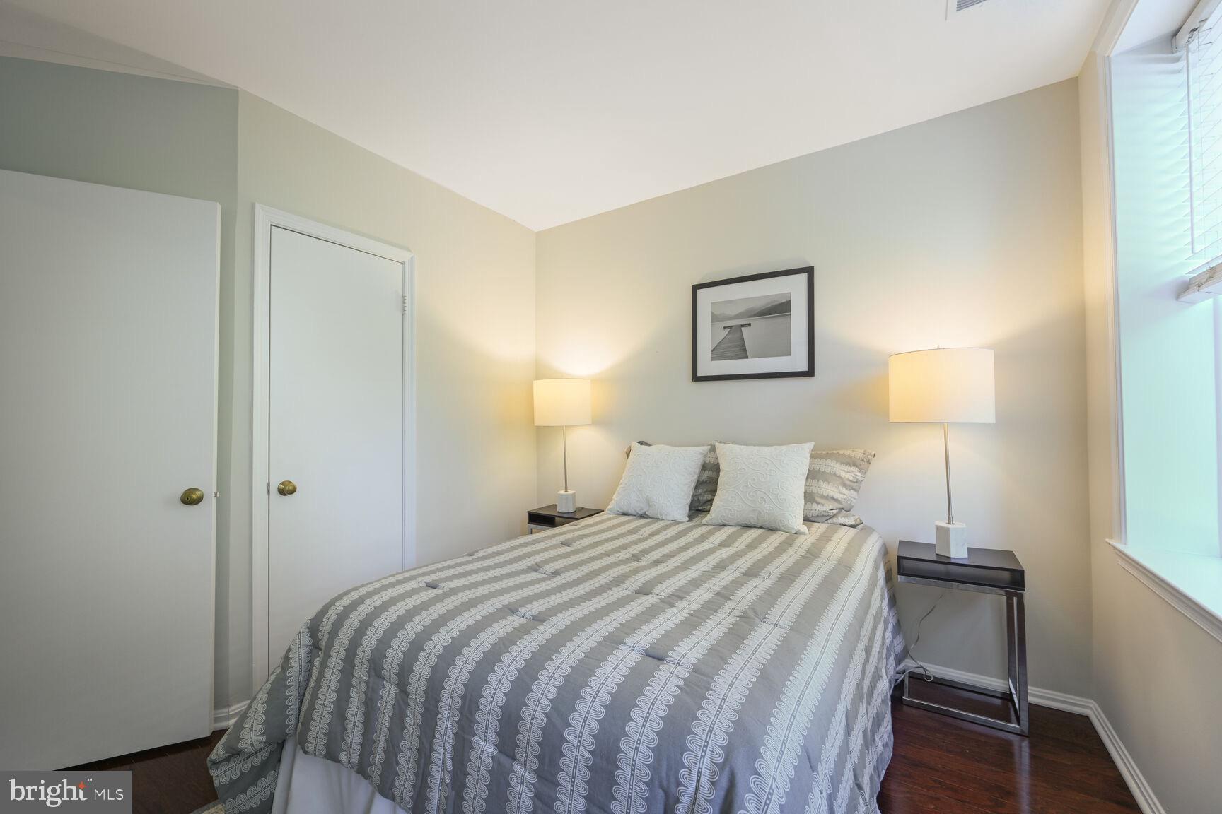 2001 16th Street Northwest, Unit 203 Washington, DC 20009 - Photo 9 of 15 a bedroom with a bed and a window