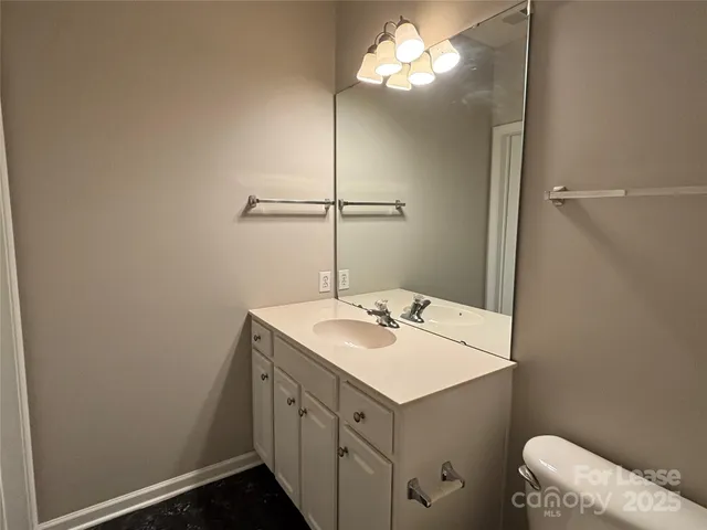 a bathroom with a sink a vanity and a mirror
