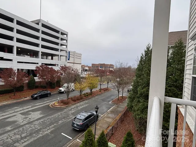 a view of a city street with tall buildings