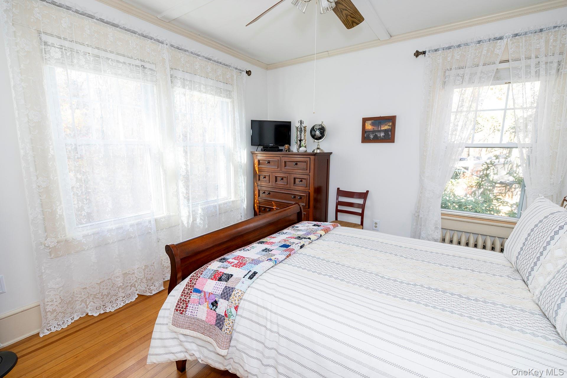 145 Drake Road Pleasant Valley, NY 12569 - Photo 16 of 47 a bedroom with a bed a flat screen tv and a window