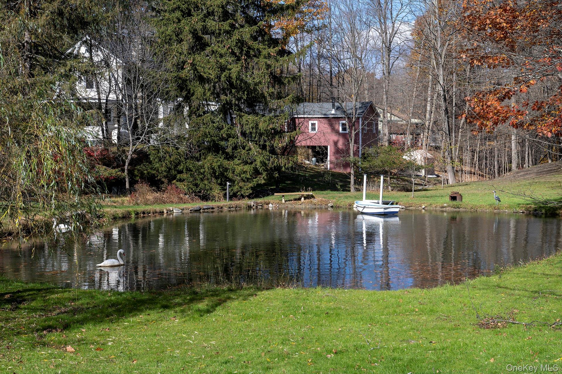 145 Drake Road Pleasant Valley, NY 12569 - Photo 27 of 47 a view of a lake with a house in the background