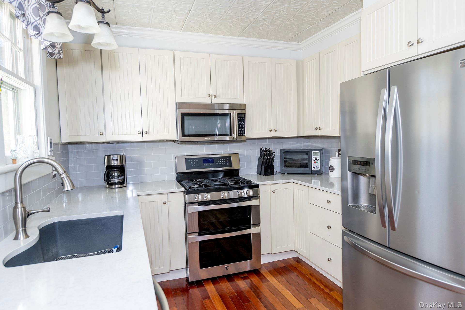 145 Drake Road Pleasant Valley, NY 12569 - Photo 6 of 47 a kitchen with granite countertop a refrigerator stove and sink