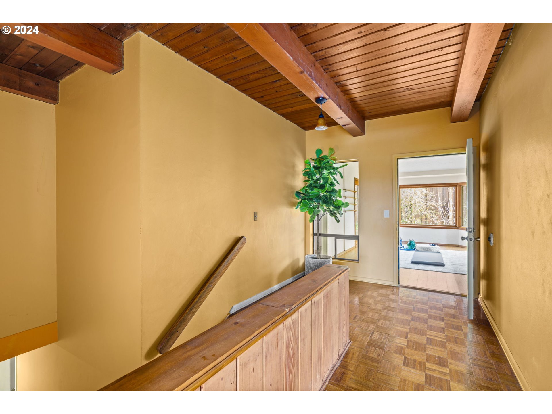 436 West D Street Springfield, OR 97477 - Photo 25 of 42 a hallway with a large window and wooden floor