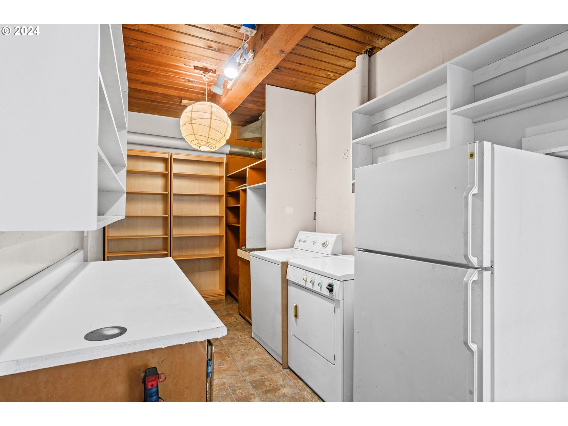 436 West D Street Springfield, OR 97477 - Photo 9 of 42 a kitchen with white cabinets and white appliances