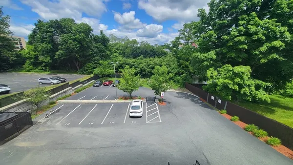 a view of a patio with table and chairs and potted plants