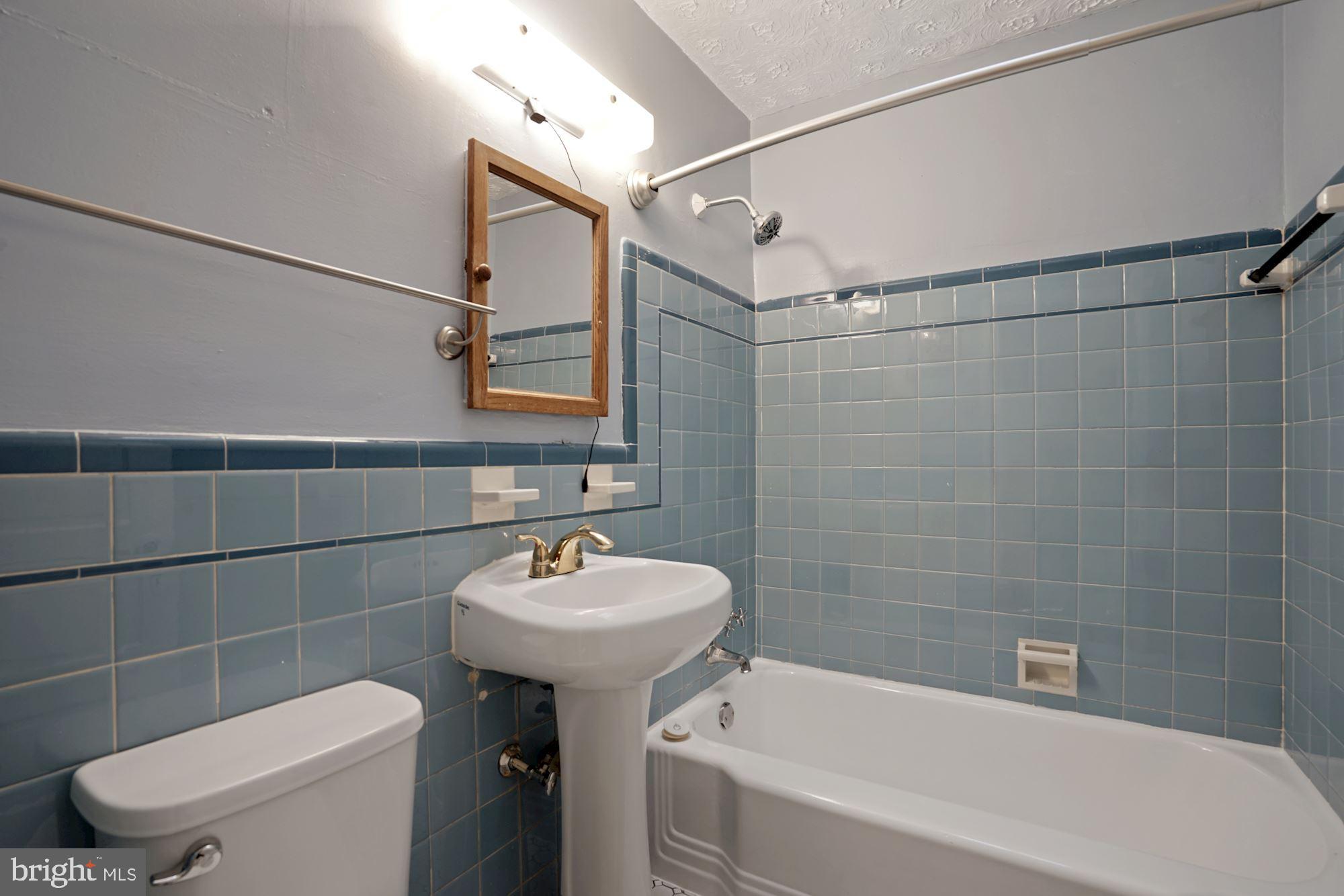 4237 Benning Road Northeast Washington, DC 20019 - Photo 17 of 28 Upper level bathroom has skylight