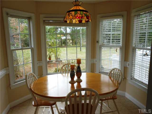 741 Gold Sand Road Louisburg, NC 27549 - Photo 19 of 25 Sunroom with a full view of the farm