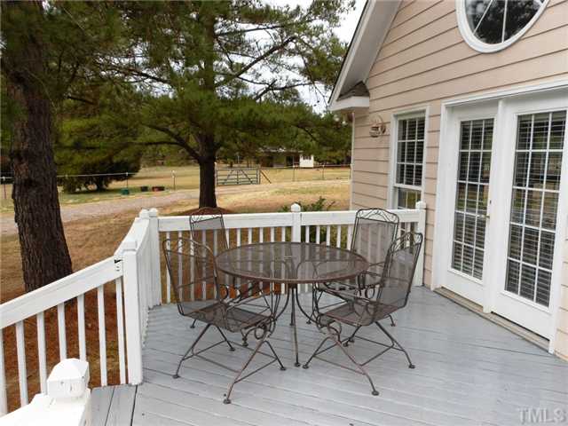 741 Gold Sand Road Louisburg, NC 27549 - Photo 20 of 25 Hang out on the back deck and relax after a day of playing with the horses