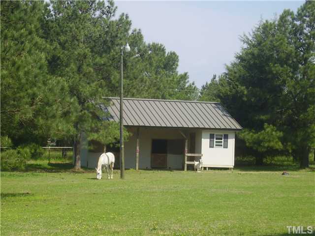 741 Gold Sand Road Louisburg, NC 27549 - Photo 3 of 25 Annabell loves her barn - with 2 stalls, tack, feed and hay storage