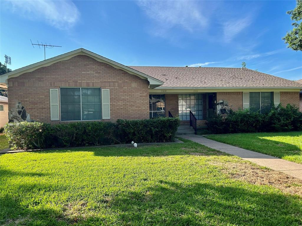 7458 Walling Lane Dallas, TX 75231 - Photo 1 of 10 a view of a house with garden and yard