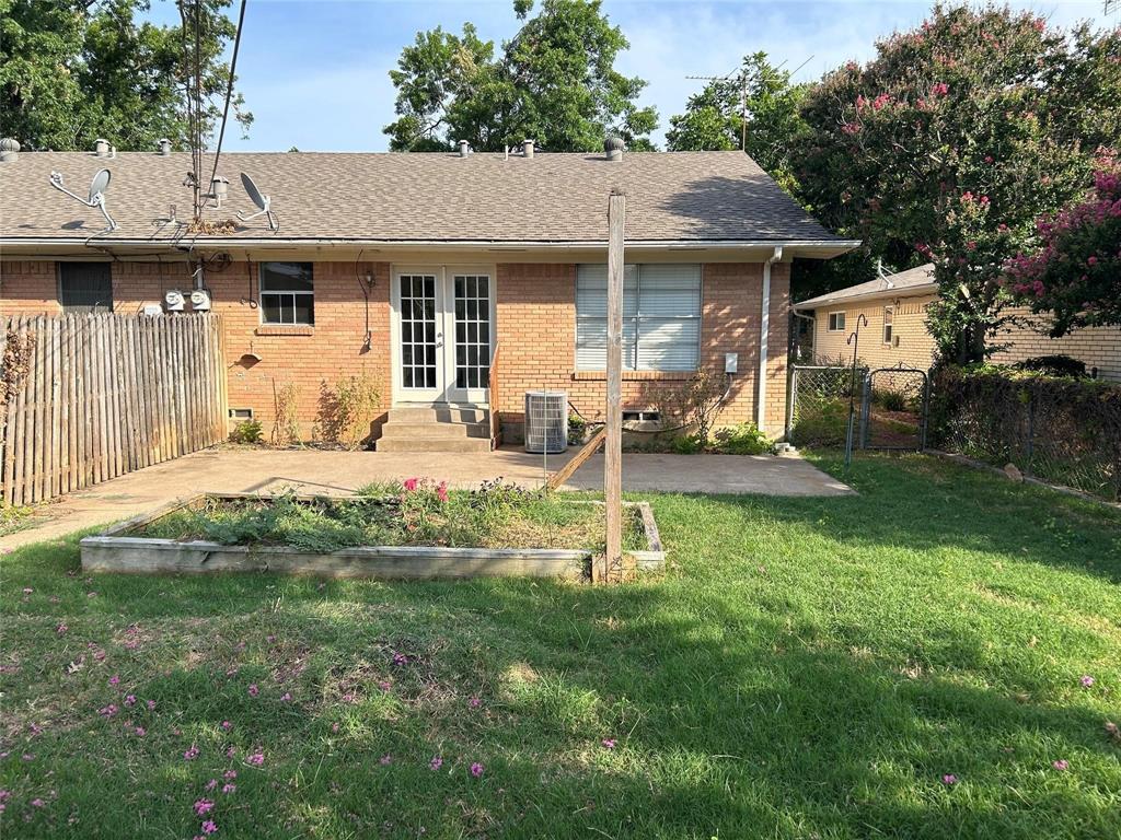 7458 Walling Lane Dallas, TX 75231 - Photo 9 of 10 a front view of a house with garden and porch