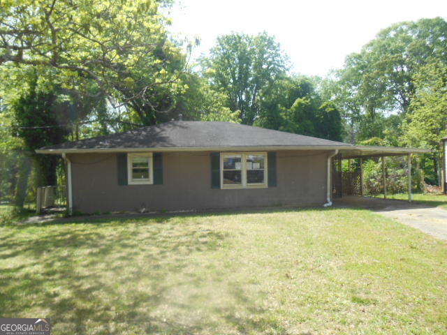 1391 Peachcrest Road Decatur, GA 30032 - Photo 1 of 1 a view of a house with a yard