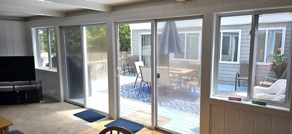 35 Tecumseh Road Wellfleet, MA 02667 - Photo 24 of 24 a room with balcony view and a floor to ceiling window