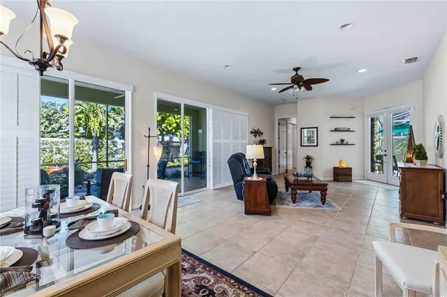 a living room with furniture potted plant and a window