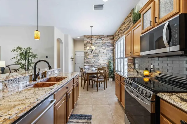 a living room with furniture a rug and a window