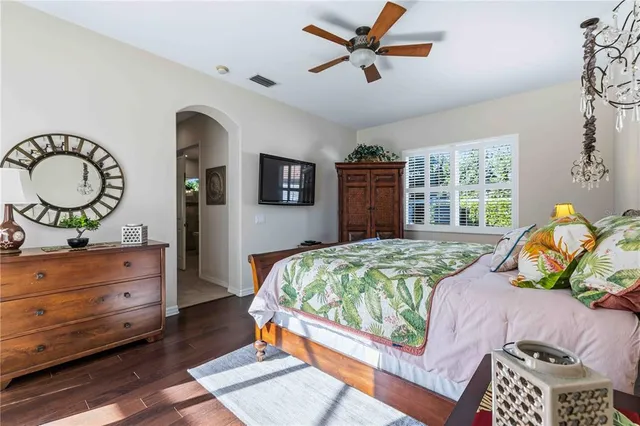 a spacious bathroom with a double vanity sink mirror and bathtub