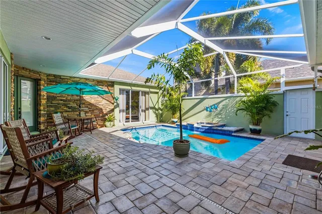 a view of outdoor space with swimming pool and furniture