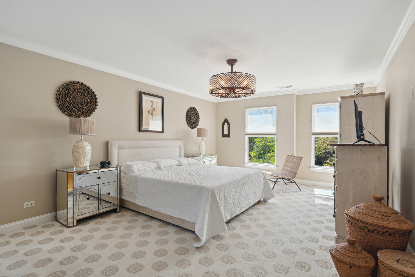 775 Endicott Road Highwood, IL 60040 - Photo 17 of 30 a spacious bedroom with a bed and a chandelier