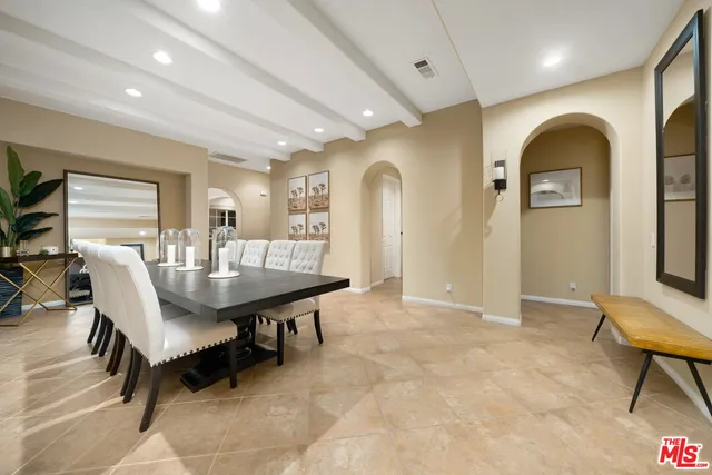 a view of a livingroom with furniture and a dining table