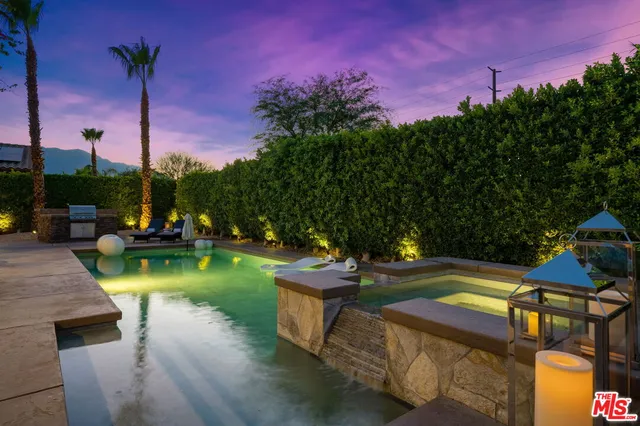 a view of a swimming pool with a patio