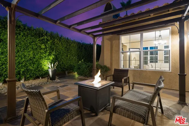 a backyard of a house with outdoor seating