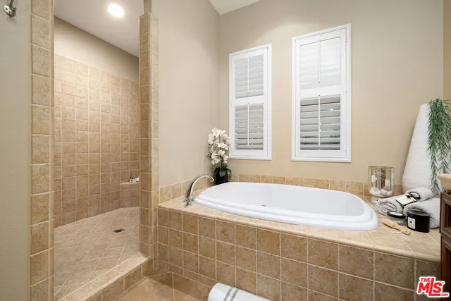 a bath tub sitting next to a window