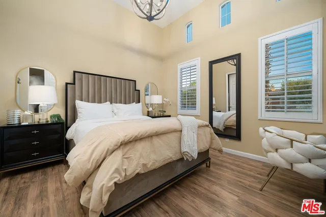 a bedroom with bed and a window