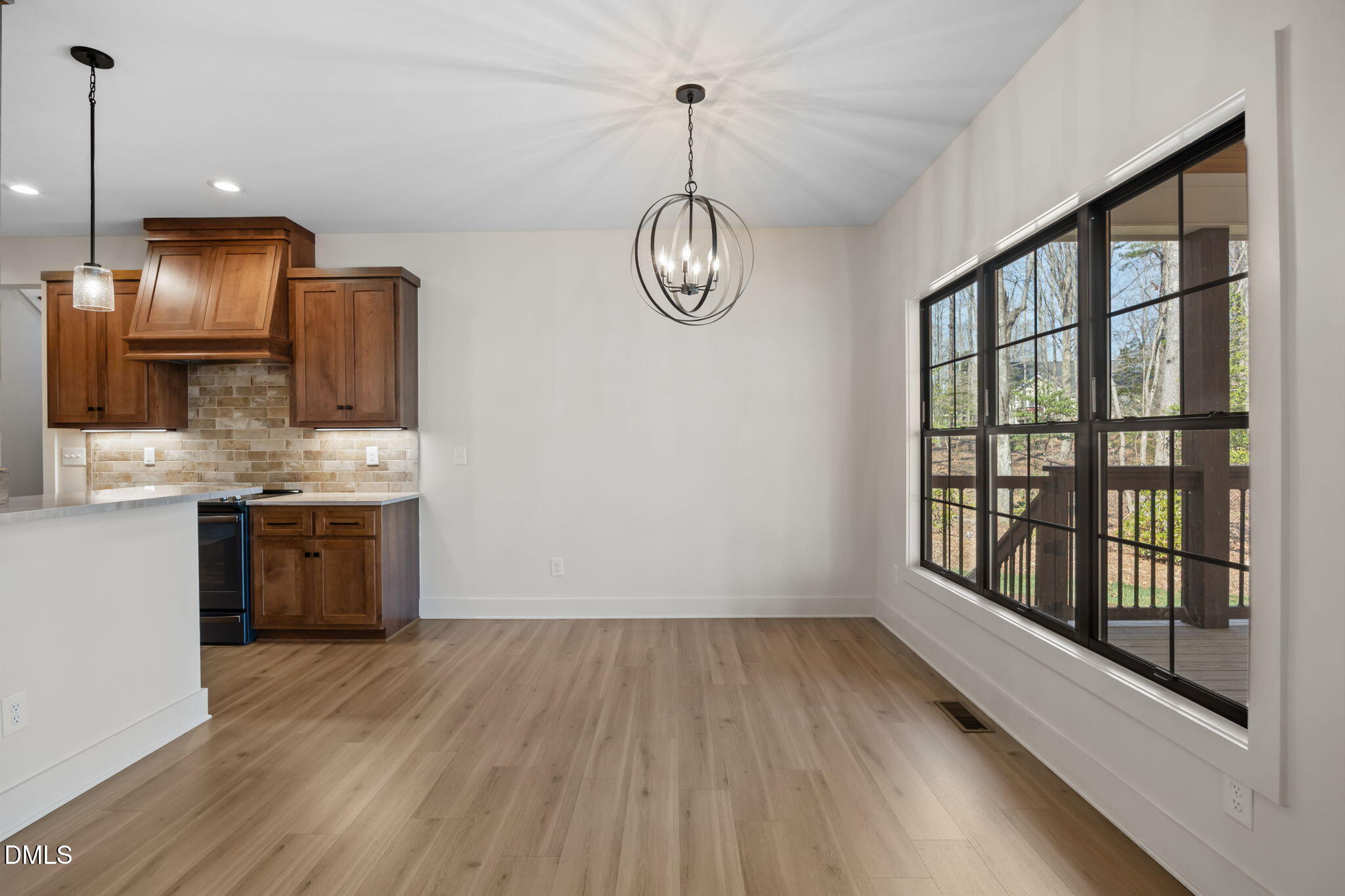 6450 Moores Mill Road Rougemont, NC 27572 - Photo 13 of 66 a view of a kitchen with a sink wooden floor and cabinets