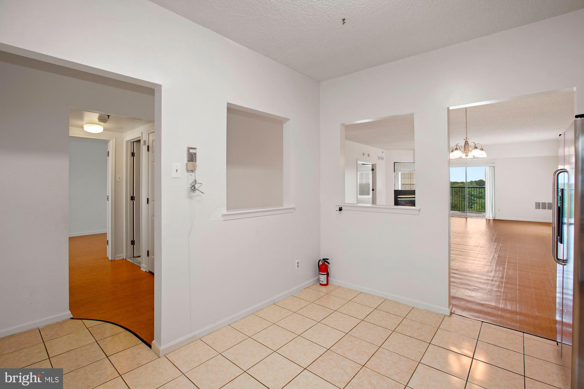6250 Main Street Voorhees, NJ 08043 - Photo 11 of 28 a view of kitchen with furniture and wooden floor