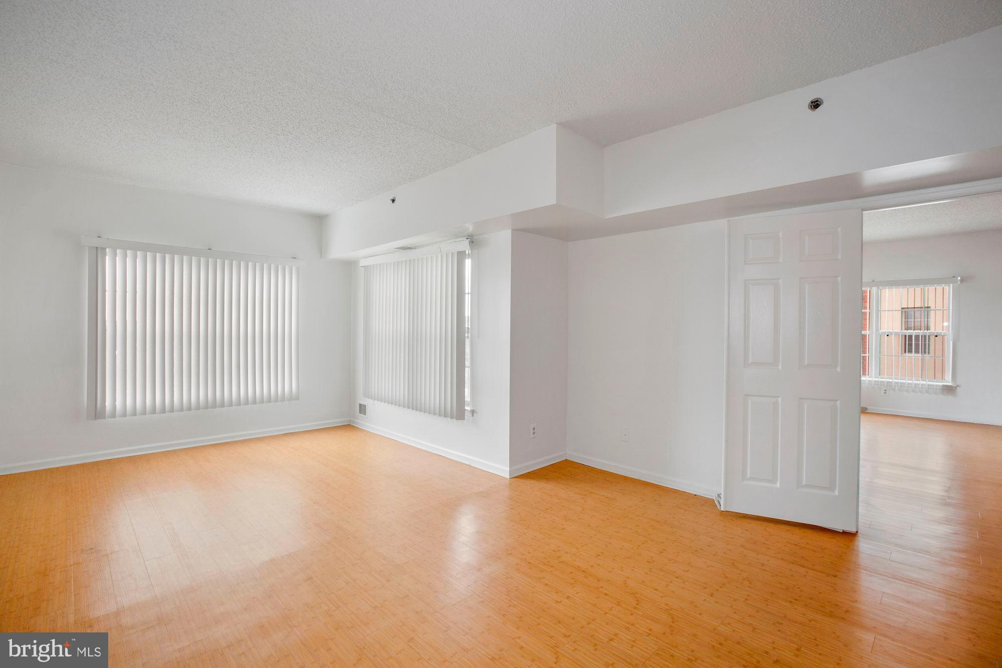 6250 Main Street Voorhees, NJ 08043 - Photo 12 of 28 a view of an empty room with wooden floor and a window