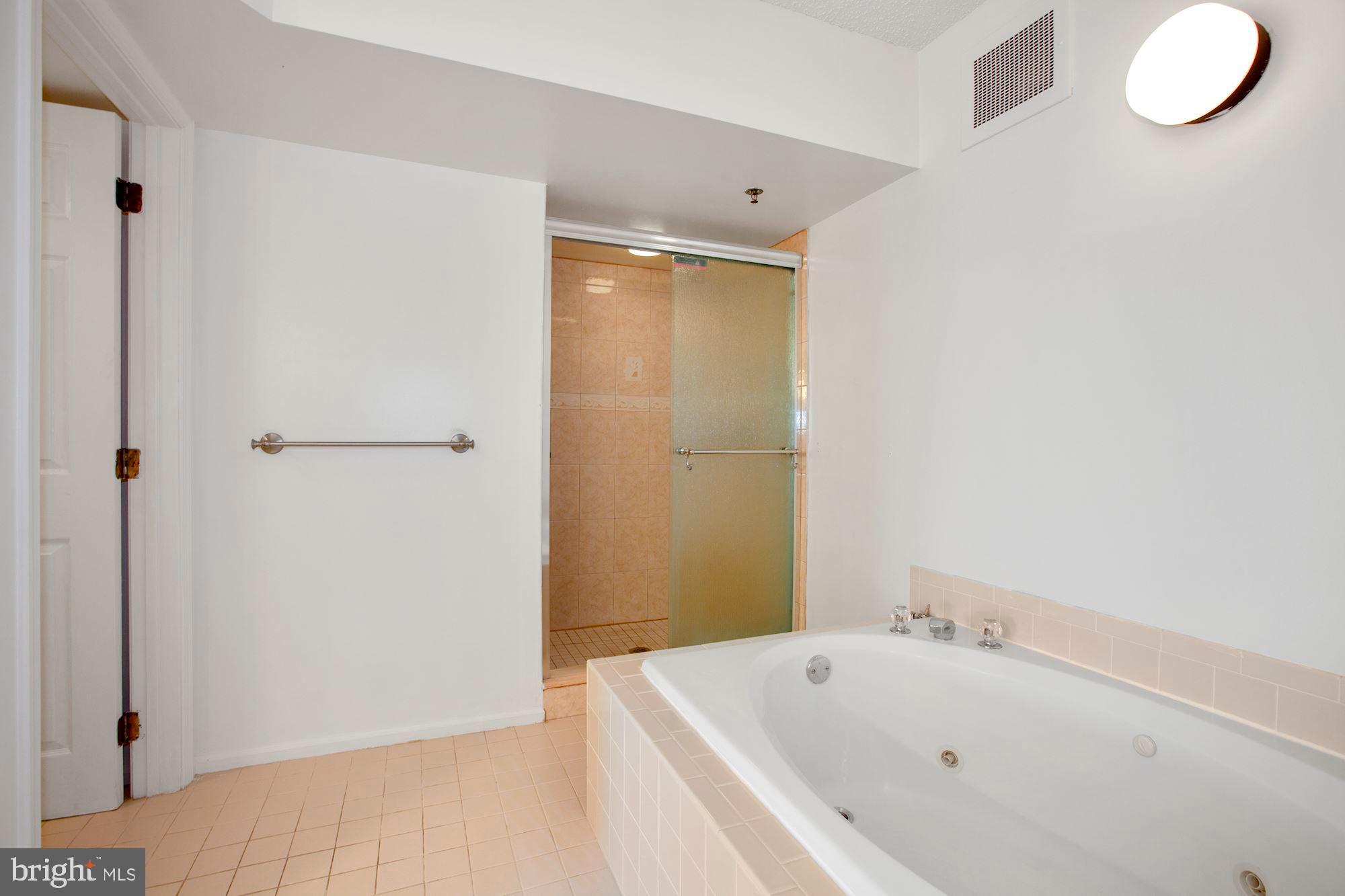 6250 Main Street Voorhees, NJ 08043 - Photo 15 of 28 a bathroom with a tub and sink