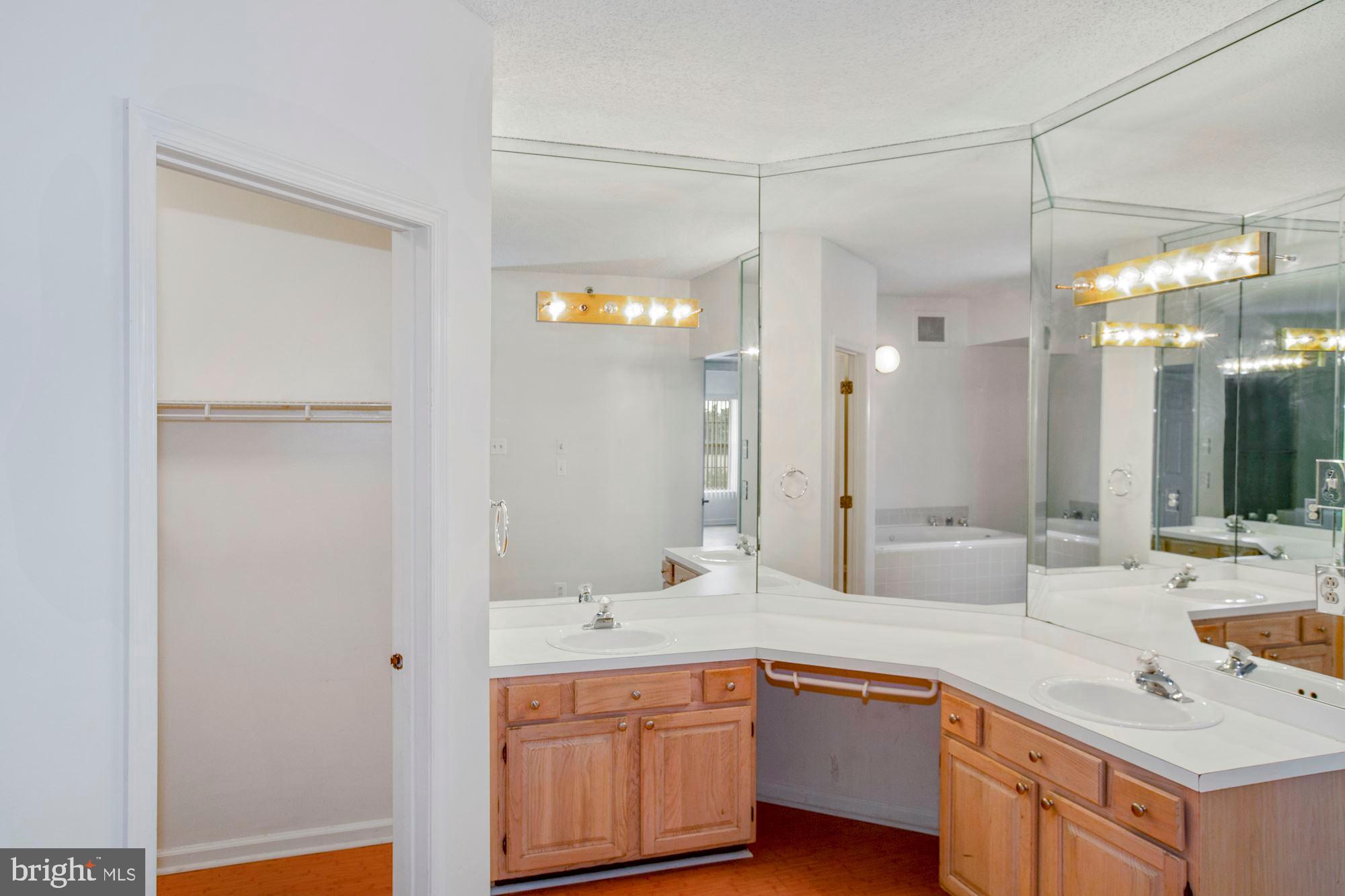 6250 Main Street Voorhees, NJ 08043 - Photo 17 of 28 a view of a bathroom sink and a mirror