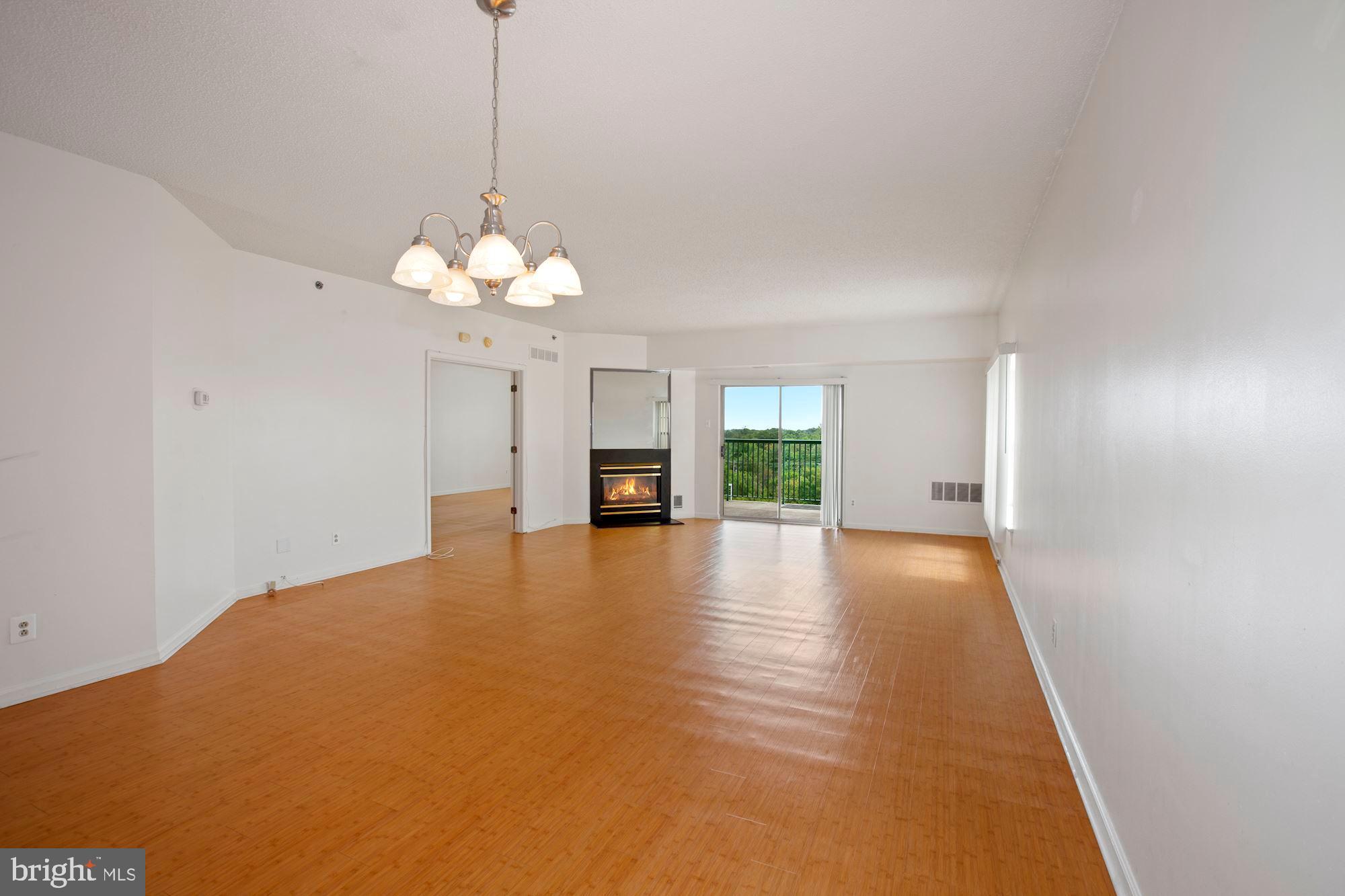 6250 Main Street Voorhees, NJ 08043 - Photo 3 of 28 a view of a livingroom with a chandelier fan and windows