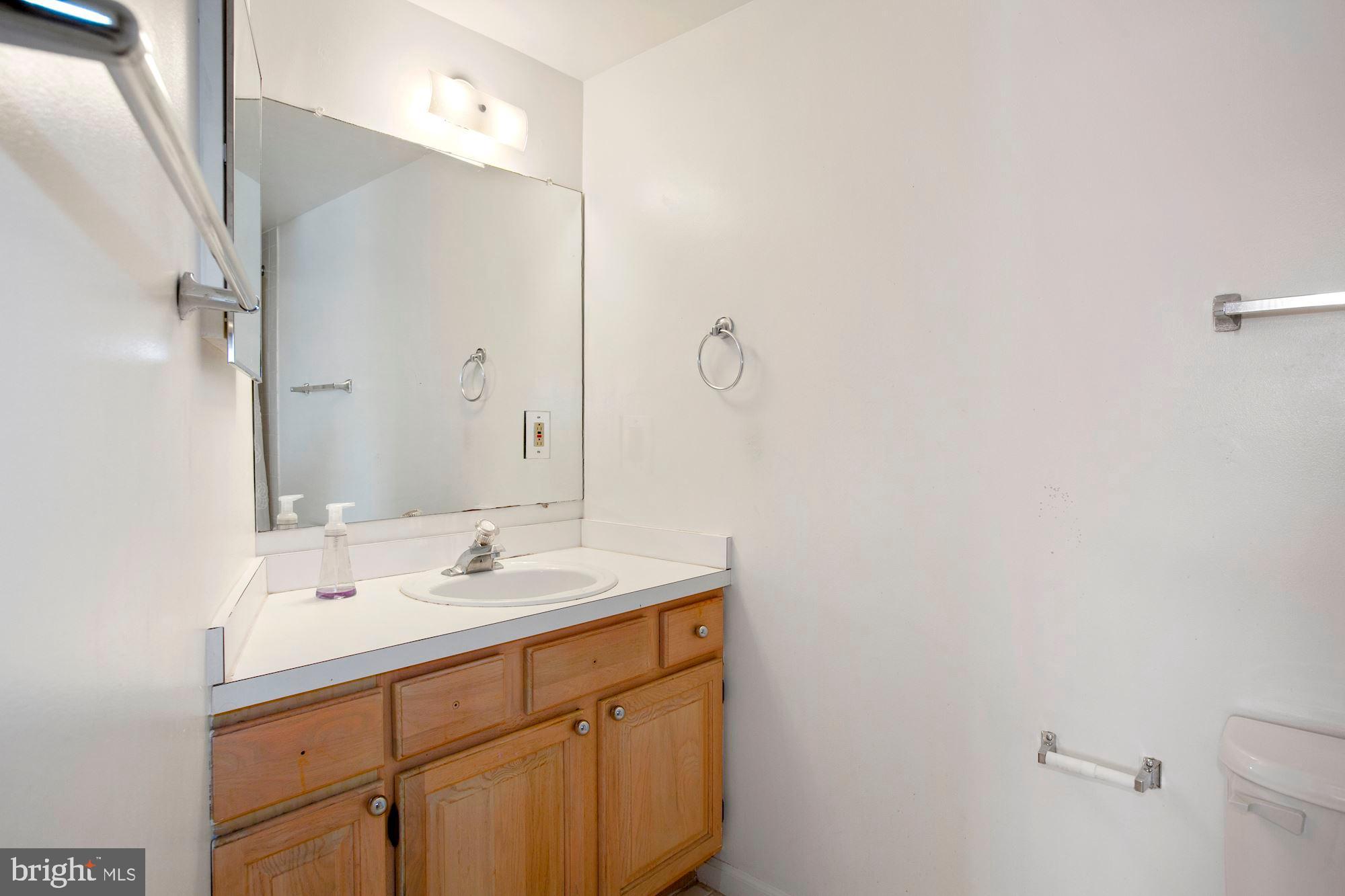 6250 Main Street Voorhees, NJ 08043 - Photo 21 of 28 a bathroom with a sink and a mirror