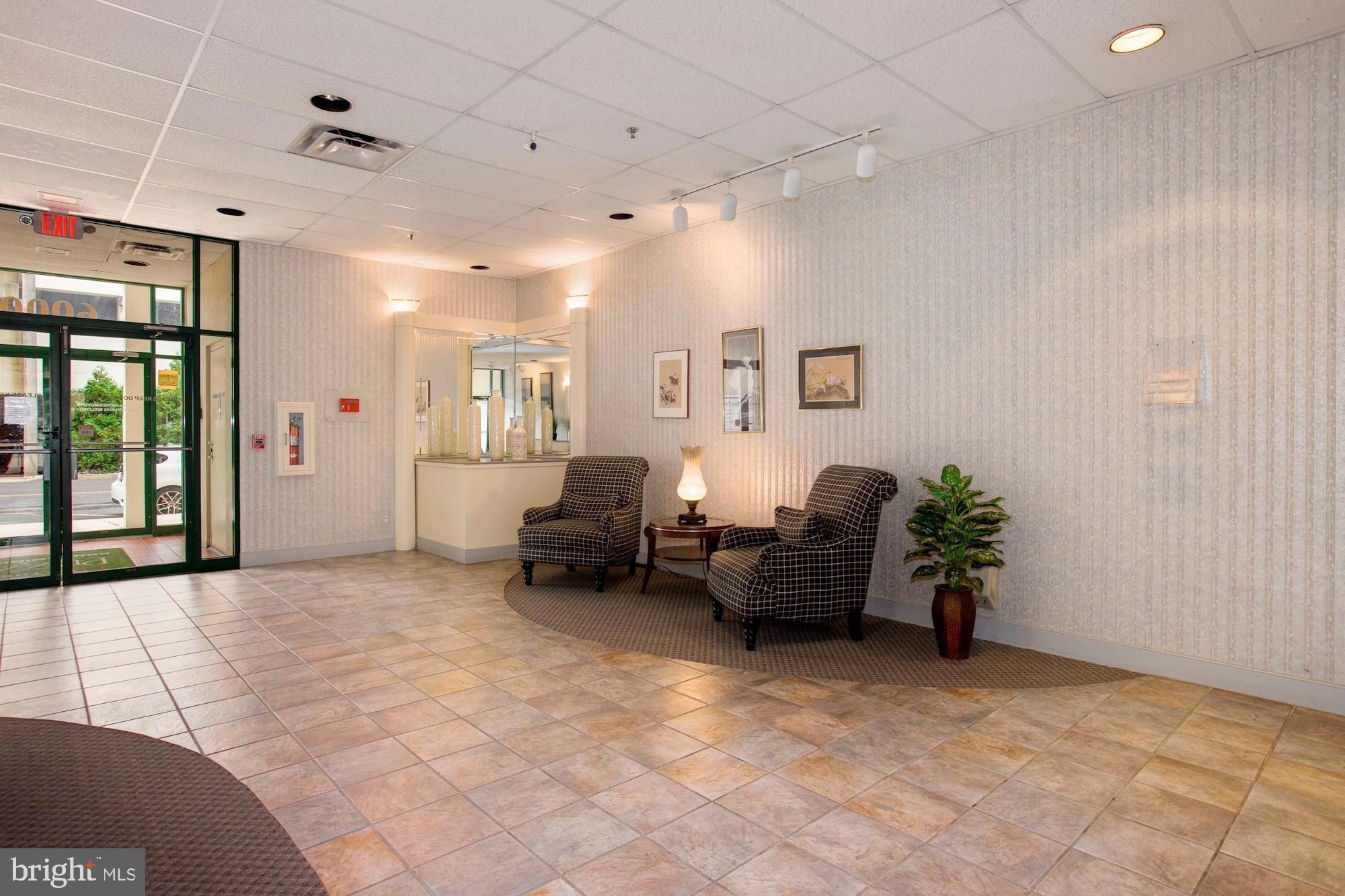 6250 Main Street Voorhees, NJ 08043 - Photo 25 of 28 a living room with furniture and a potted plant
