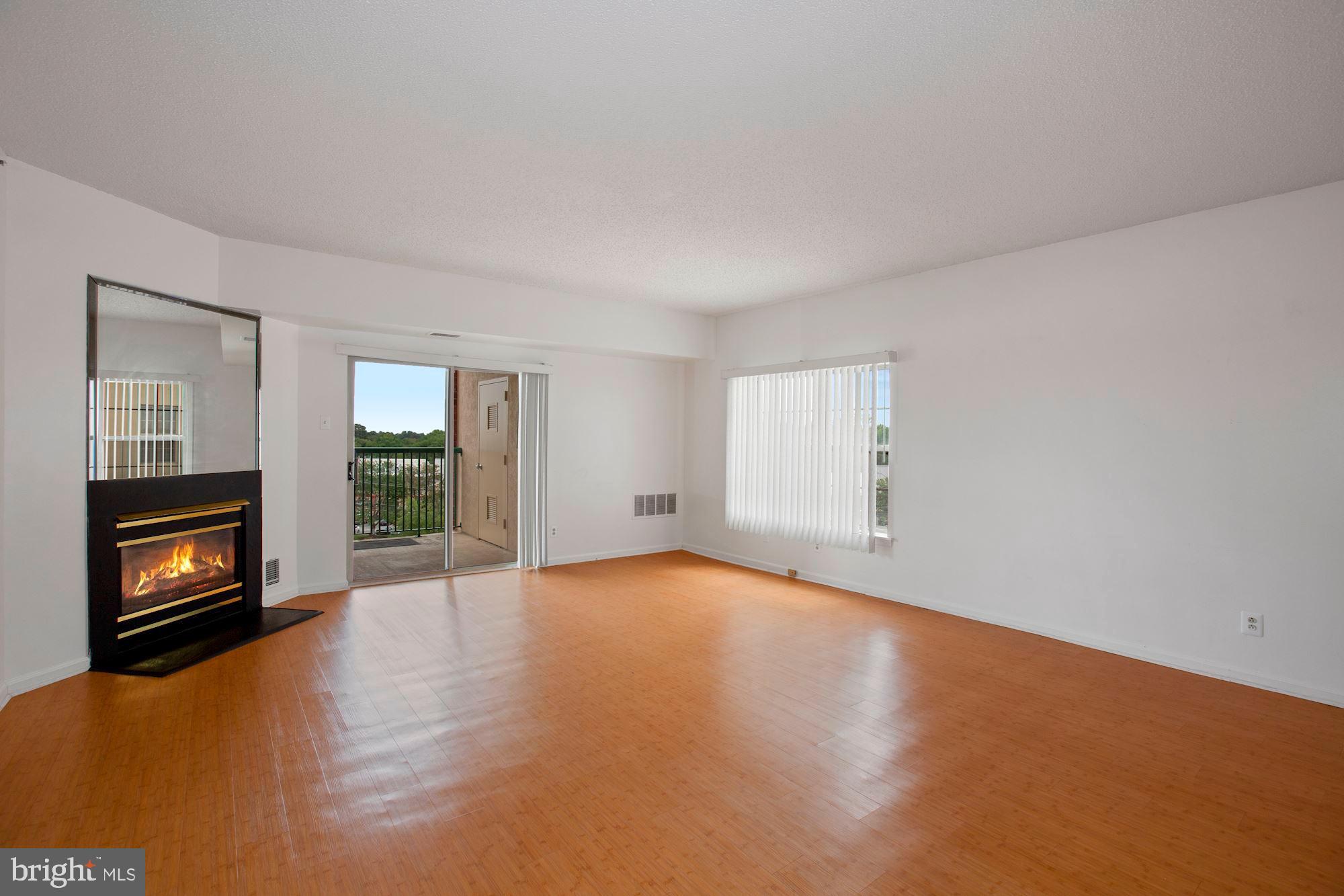 6250 Main Street Voorhees, NJ 08043 - Photo 4 of 28 a view of an empty room with window and fire place
