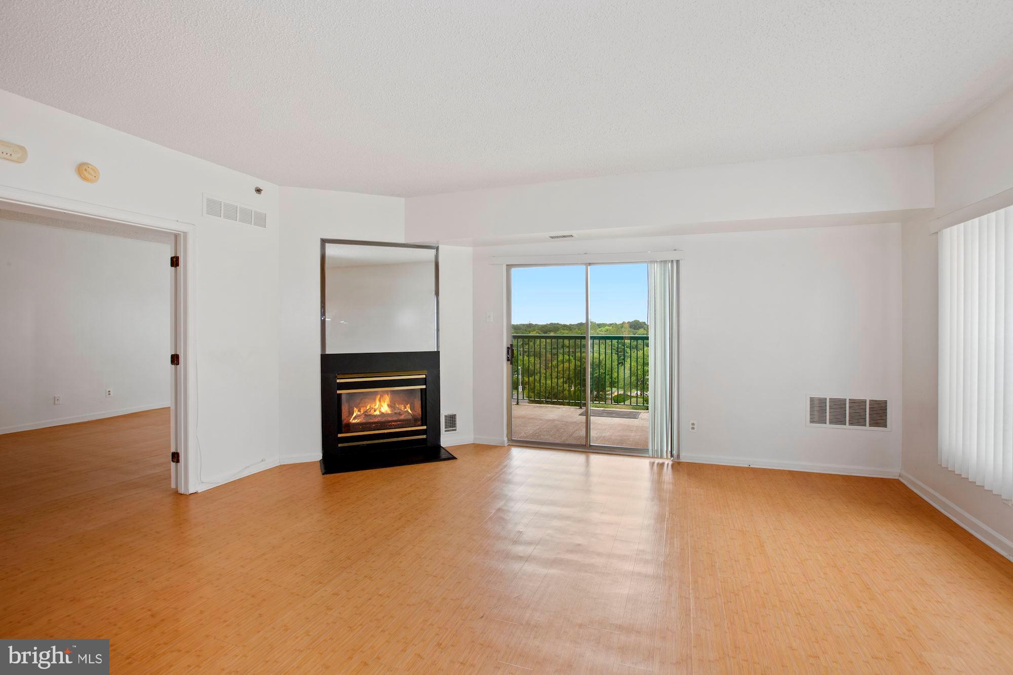 6250 Main Street Voorhees, NJ 08043 - Photo 5 of 28 an empty room with windows and fireplace