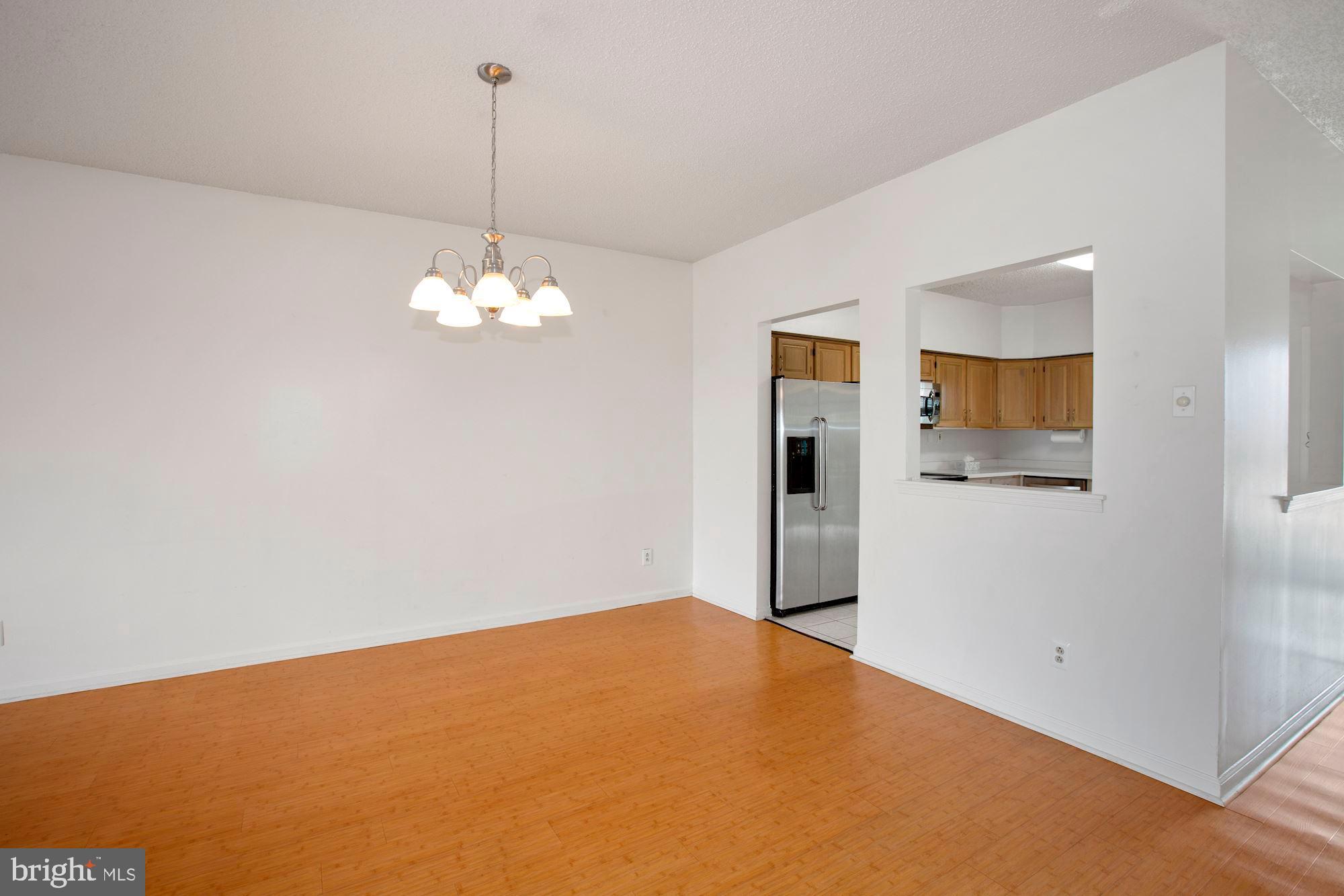 6250 Main Street Voorhees, NJ 08043 - Photo 7 of 28 a view of a hallway with a chandelier