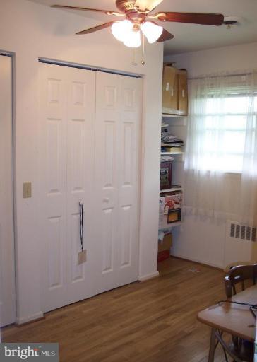 2319 Farringdon Road Baltimore, MD 21209 - Photo 8 of 16 a view of a storage & utility room with wooden floor