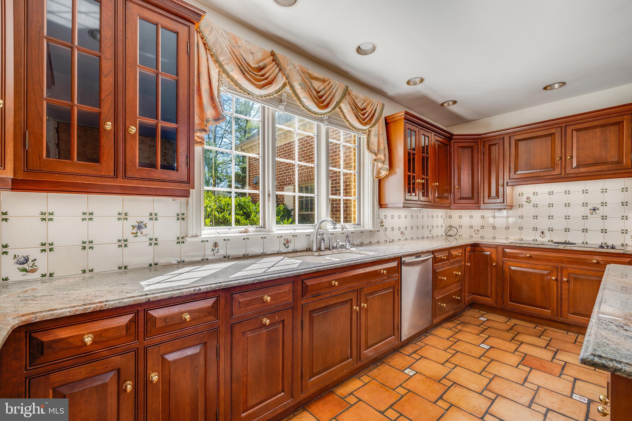 1821 Museum Road Wyomissing, PA 19610 - Photo 24 of 68 a kitchen with stainless steel appliances granite countertop a sink and cabinets