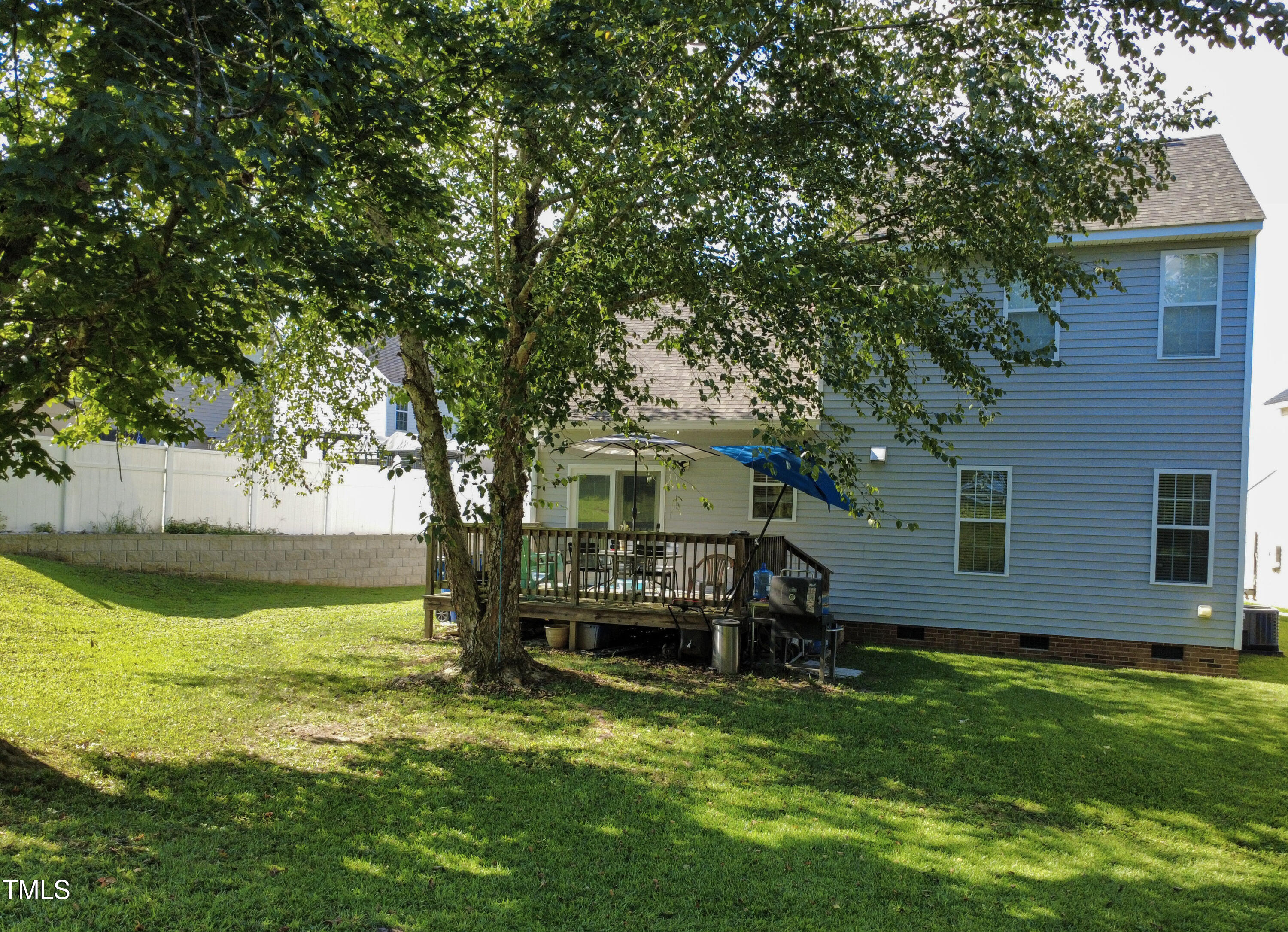 2704 Hope Diamond Court Raleigh, NC 27610 - Photo 9 of 12 a view of a house with a yard porch and sitting area