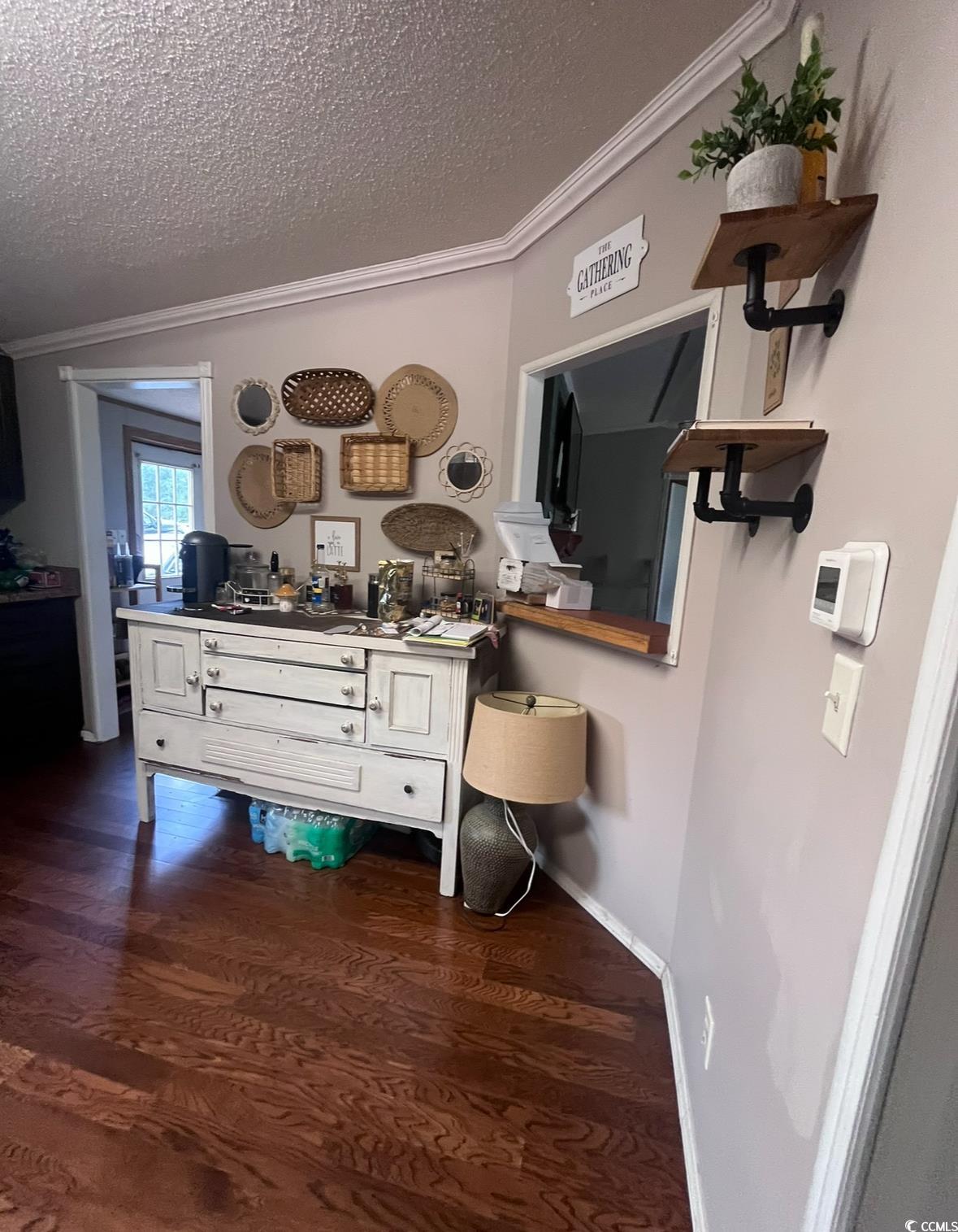 7096 Johnson Shortcut Road Conway, SC 29527 - Photo 7 of 16 Detailed view of ornamental molding, wood finished floors, and a textured ceiling