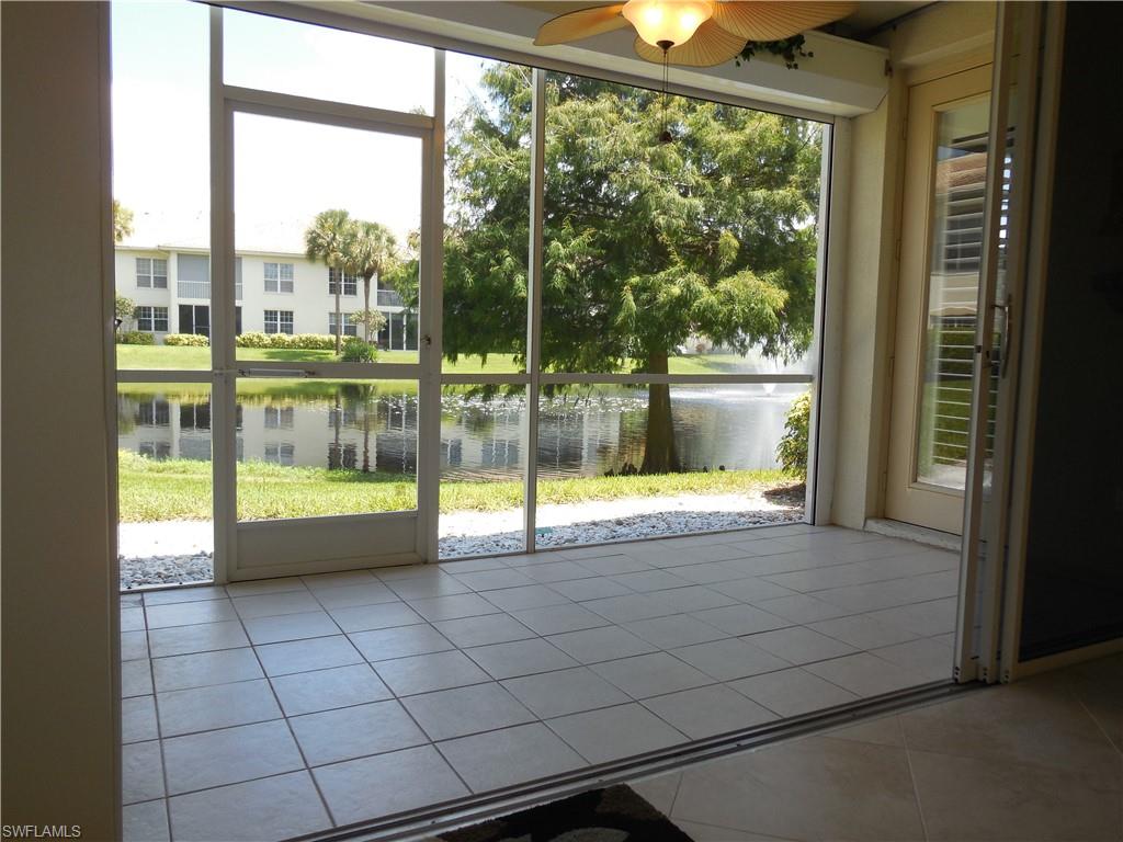 1265 Egrets Landing, Unit 101 Naples, FL 34108 - Photo 11 of 28 a view of an empty room and window