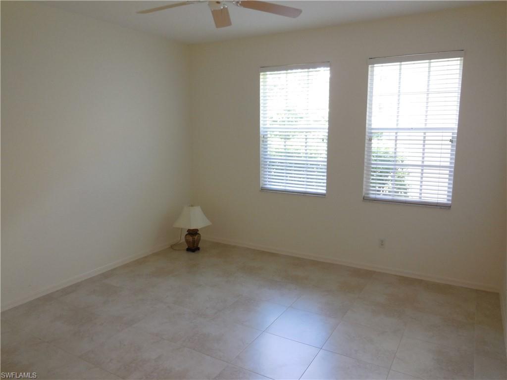 1265 Egrets Landing, Unit 101 Naples, FL 34108 - Photo 22 of 28 an empty room with a window