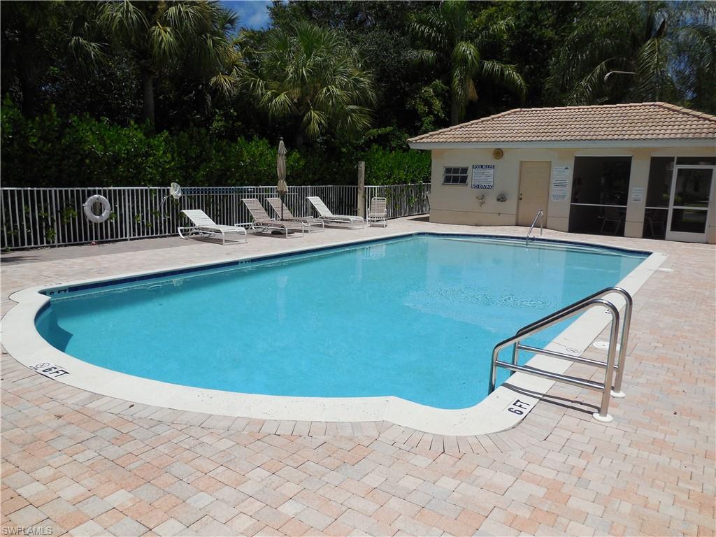 1265 Egrets Landing, Unit 101 Naples, FL 34108 - Photo 28 of 28 a view of outdoor space and swimming pool