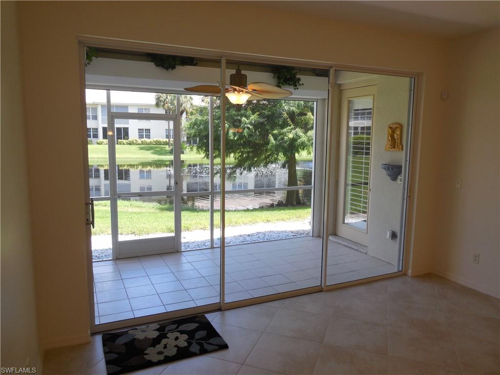 1265 Egrets Landing, Unit 101 Naples, FL 34108 - Photo 6 of 28 a view of an empty room and window