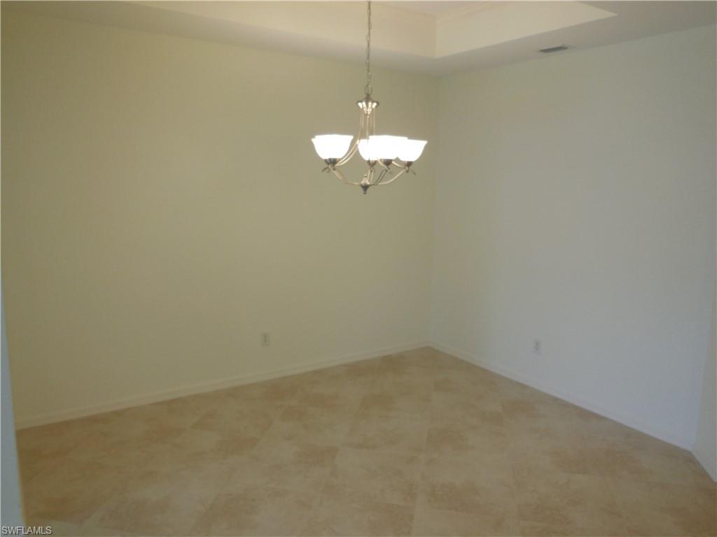 1265 Egrets Landing, Unit 101 Naples, FL 34108 - Photo 10 of 28 a very nice looking room
