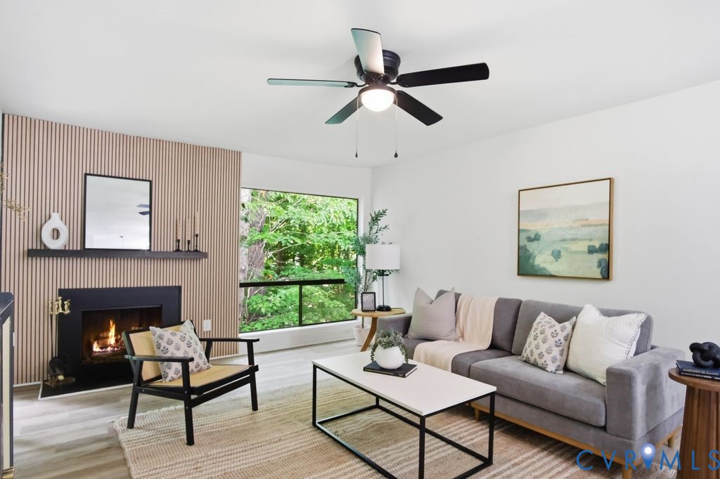 10270 Iron Mill Road Richmond, VA 23235 - Photo 14 of 29 Living area with a floor-to-ceiling window, wood-f