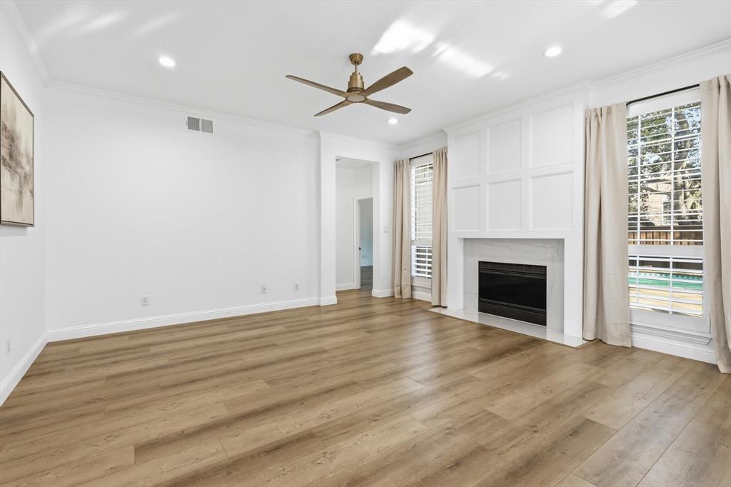 3408 Druid Way Flower Mound, TX 75028 - Photo 13 of 36 a view of empty room with wooden floor and fireplace