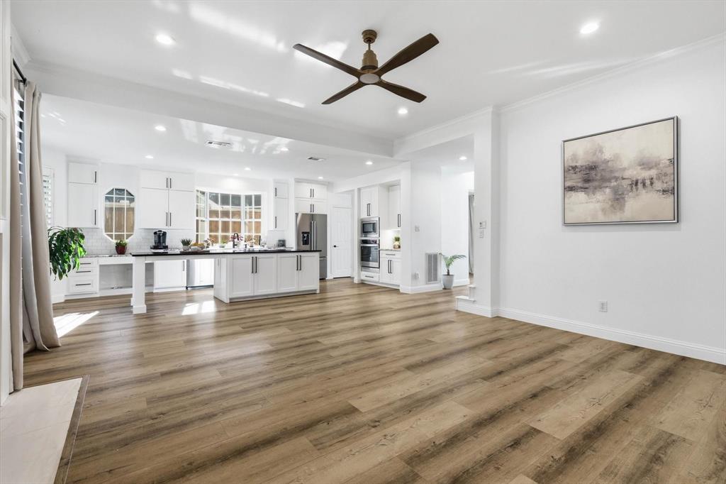 3408 Druid Way Flower Mound, TX 75028 - Photo 15 of 36 a view of empty room with wooden floor and a ceiling fan